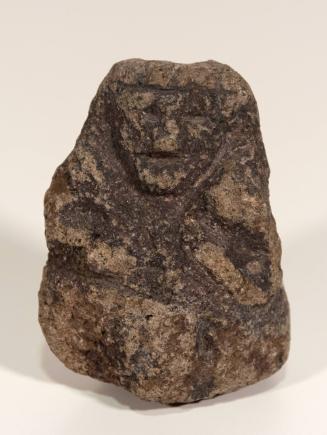 [Carved stone figure]