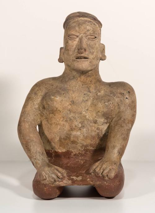 [Kneeling female figure]