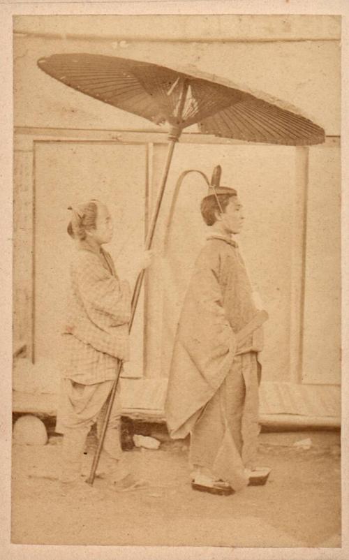 Priest and retainer with umbrella