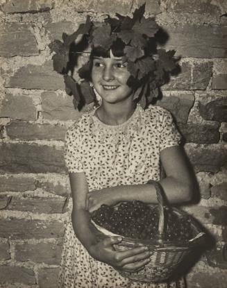 Little girl with vine-leaf garland and basket of grapes, Chateau de Pommery, Reims