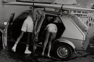 Man and woman reaching into car, Côte d’Azur, France