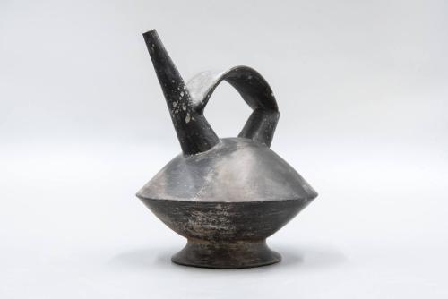 [Double spouted vessel with bridge handle]