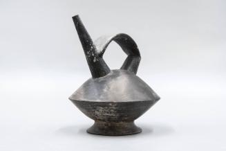 [Double spouted vessel with bridge handle]