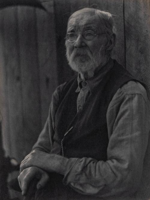 [Portrait of elderly man wearing glasses and a vest]