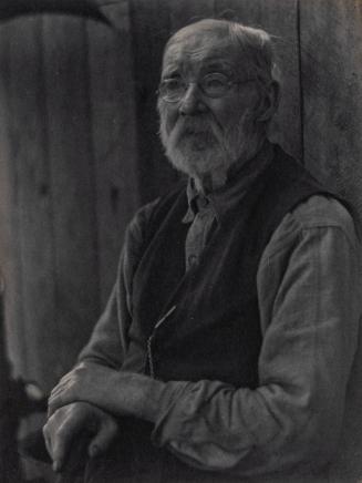 [Portrait of elderly man wearing glasses and a vest]