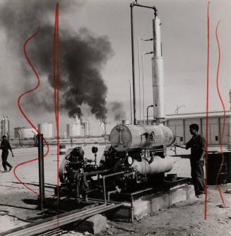 [Oil refinery (worker manning gears), Algeria]
