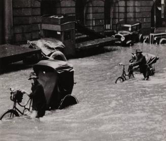 [Flooded street with rickshaw drivers]
