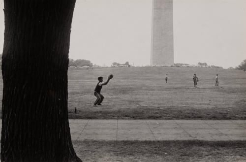 Young men playing catch on National Mall, Washington D.C.