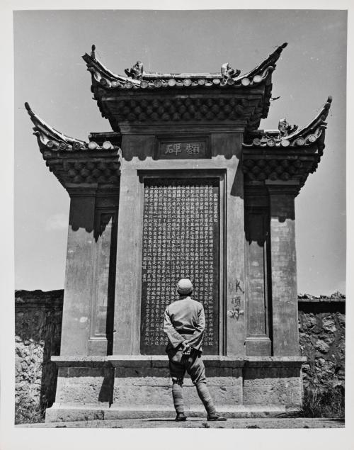 Chinese Soldier Contemplating War Memorial, Yunnan, China