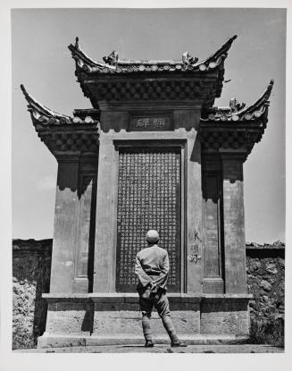 Chinese Soldier Contemplating War Memorial, Yunnan, China