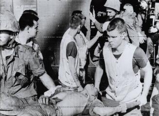 Wounded North Vietnamese Soldier Taken to U.S. Carrier