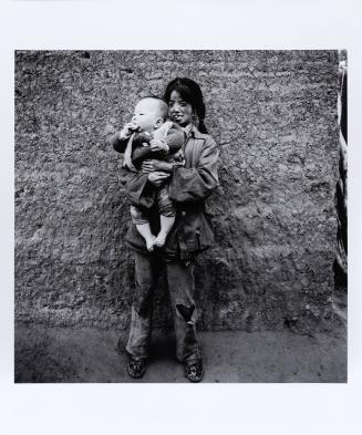 A Mentally Handicapped Muslim Girl with her Nephew, Xihaigu, Ningxia Province