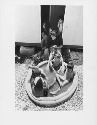 Children playing in inflatable pool, Elon Moreh settlement, West Bank