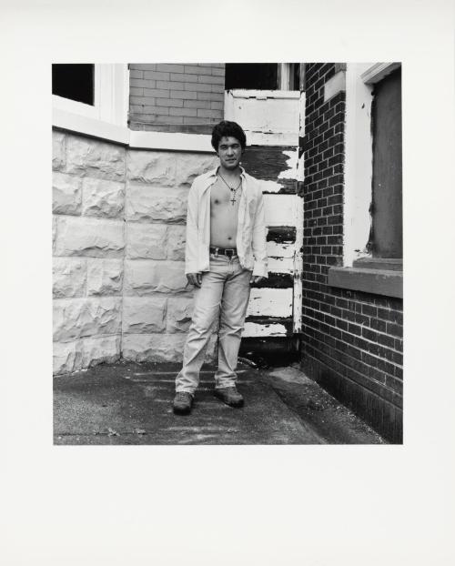 [Man wearing crucifix]