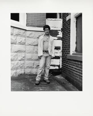 [Man wearing crucifix]