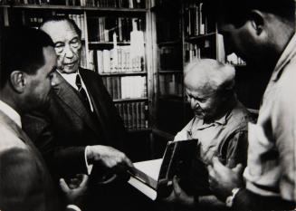 The State visit of German Chancellor Konrad Adenauer to Israel, visiting with former Prime Minister David Ben Gurion: looking at books in Ben Gurion's study at Kibbutz Sde Boker
