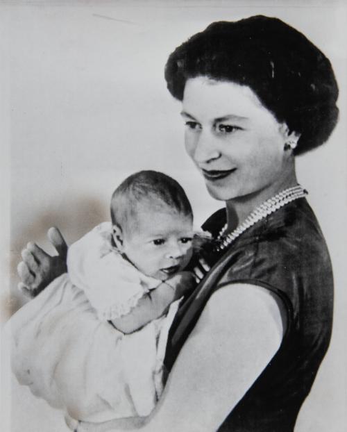 Queen Elizabeth held her new son, Andrew Albert Christian Edward, at Buckingham palace in London. The child, born Feb. 19, will be known as Prince Andrew.