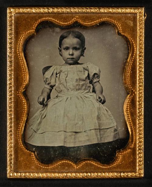 [Child in dress]