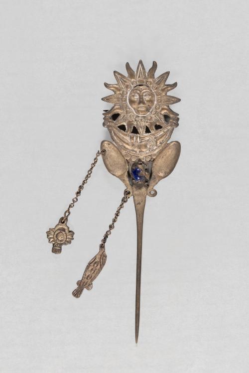 [Pin with sun and moon motif]
