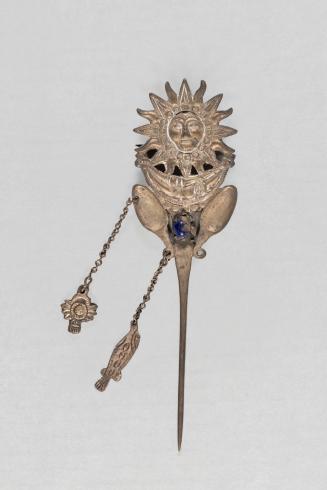 [Pin with sun and moon motif]