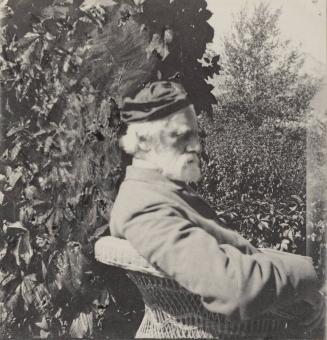 [Side profile of older man sitting in chair]