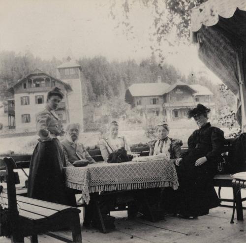 [Group portrait at an outdoor table]