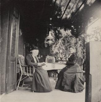 [Two women sit and read]