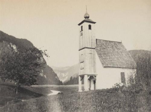 [White building and tree in landscape]