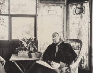 [Portrait of a seated woman]