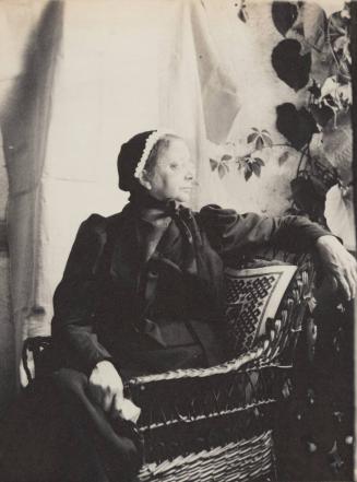 [Portrait of a seated woman]
