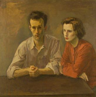 Young Couple Seated At Table