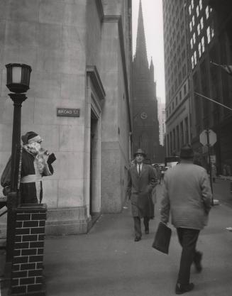 Wall and Broad Street, looking at Trinity Church, NYC