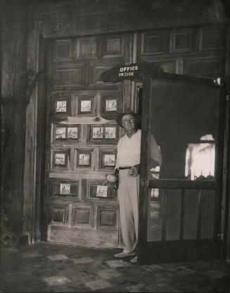 Untitled (Waldo Sexton standing in office door at the Driftwood Inn, Vero Beach, Florida)
