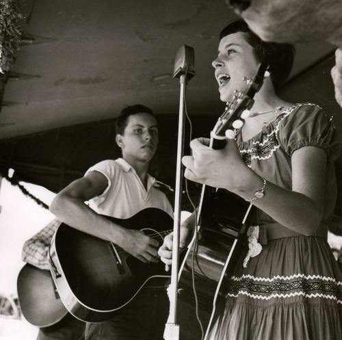 Untitled [two musicians, girl at microphone singing]