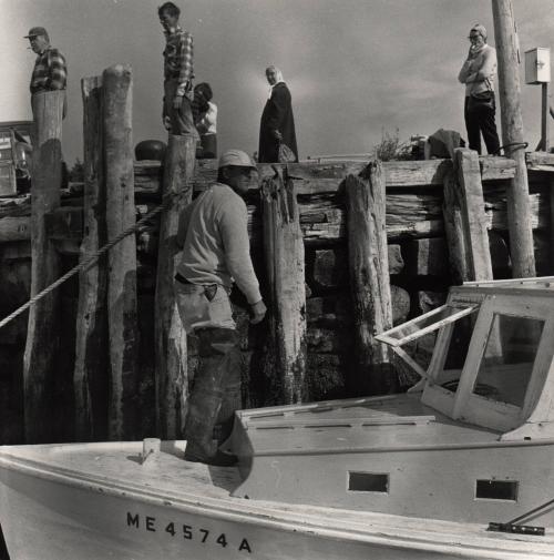 Fishermen on a docked boat