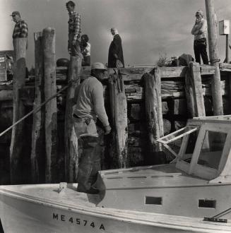 Fishermen on a docked boat