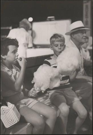 Untitled (two children eating cotton candy)