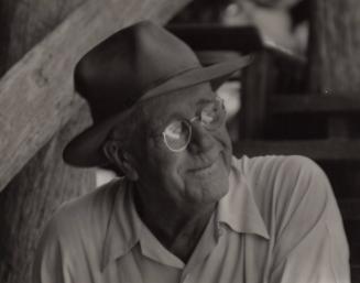 Untitled, (Waldo Sexton, close up wearing glasses, seated on steps at the Driftwood Inn, Vero Beach, Florida)