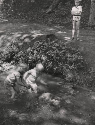 Untitled [little girls playing in a stream]