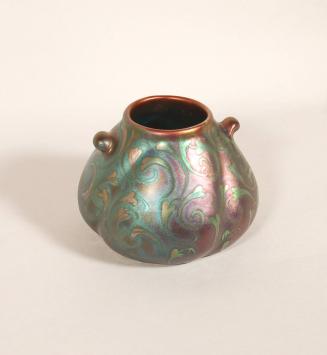 [Vase, swirl pattern, metallic]