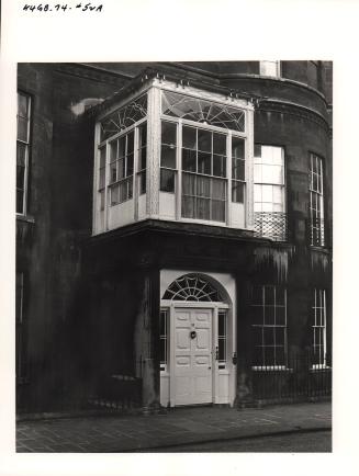 Doorway with enclosed porch overhead